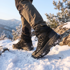 Frost High-Top Winter Hiking Boots worn on a snowy trail